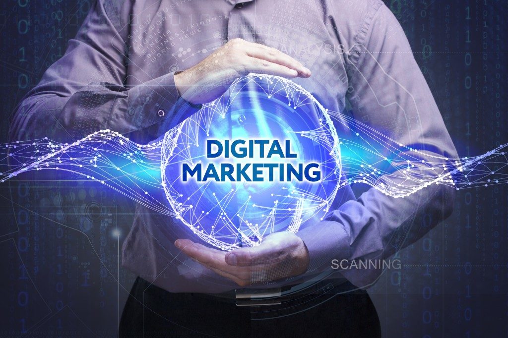 man holding a digital marketing sphere