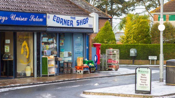 The outside of a store called the corner shop during winter