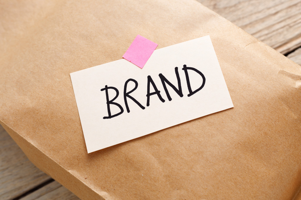 A note with the word Brand on a brown paper bag