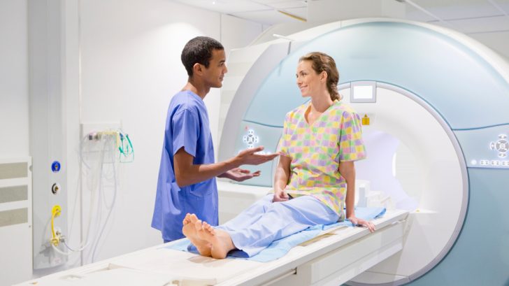 nurse talking to patient at MRI scan machine